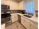 Modern kitchen featuring stainless steel appliances and bright lighting at 1298 Gideons Sw Dr, Atlanta, GA 30314