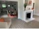 Open-concept living space featuring a fireplace, dining area, and modern flooring at 1298 Gideons Sw Dr, Atlanta, GA 30314