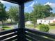 Scenic view from the front porch showcases the neighborhood's mature trees and charming houses at 1298 Gideons Sw Dr, Atlanta, GA 30314