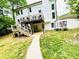Large backyard with a deck, patio area, and ample space for outdoor activities and entertaining at 2870 Willow Wisp Way, Cumming, GA 30040