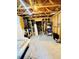 Unfinished basement area with exposed wood beams, shelving, and space for storage or customization at 2870 Willow Wisp Way, Cumming, GA 30040