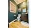 Stylish half bathroom featuring shiplap walls, modern fixtures, and a sleek vanity at 2870 Willow Wisp Way, Cumming, GA 30040