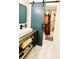 Stylish bathroom featuring a modern vanity, sliding barn door, and a shower with a decorative floral curtain at 2870 Willow Wisp Way, Cumming, GA 30040