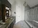 Elegant bathroom with dual sink vanity, granite countertops, and a large glass-enclosed shower at 2870 Willow Wisp Way, Cumming, GA 30040
