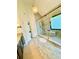 Well-lit bathroom featuring a glass shower, built-in bench, and decorative lighting at 2870 Willow Wisp Way, Cumming, GA 30040