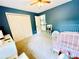 Cozy bedroom featuring a full size bed and a toy kitchen set at 2870 Willow Wisp Way, Cumming, GA 30040