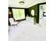 Bright bedroom features soft carpet, green walls, and windows offering outdoor views at 2870 Willow Wisp Way, Cumming, GA 30040