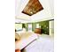 Bright bedroom featuring wood ceiling, soft carpet, and an en suite bathroom at 2870 Willow Wisp Way, Cumming, GA 30040