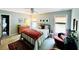 Naturally lit bedroom with earth tone furniture, art, and decor at 2870 Willow Wisp Way, Cumming, GA 30040