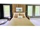 Inviting bedroom showcasing two large windows and a bed with light-colored pillows and bedspread at 2870 Willow Wisp Way, Cumming, GA 30040