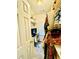 Walk-in closet space with built-in shelving, hanging rods, desk space, and natural light at 2870 Willow Wisp Way, Cumming, GA 30040