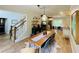 Open-concept dining area showcases wood floors, stylish furnishings, and easy access to the kitchen at 2870 Willow Wisp Way, Cumming, GA 30040