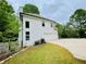 Home with a well-manicured lawn, complemented by vibrant greenery, a two-car garage, and an inviting driveway at 2870 Willow Wisp Way, Cumming, GA 30040