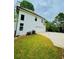 Two-story home with white siding, a large driveway, an attached garage, and green lawn at 2870 Willow Wisp Way, Cumming, GA 30040