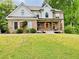 Beautiful two-story home with brick and siding, manicured lawn, and inviting front porch at 2870 Willow Wisp Way, Cumming, GA 30040