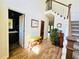 Inviting foyer with hardwood floors, a staircase, half bath, and unique vintage radio accent at 2870 Willow Wisp Way, Cumming, GA 30040