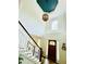 Grand foyer with high ceilings, a staircase, stylish lighting, and a welcoming entrance at 2870 Willow Wisp Way, Cumming, GA 30040