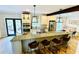 Modern kitchen featuring granite countertops, stainless steel appliances, and an island with barstool seating at 2870 Willow Wisp Way, Cumming, GA 30040