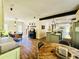 Open concept with kitchen, dining, and living room areas with wood floors and a breakfast bar at 2870 Willow Wisp Way, Cumming, GA 30040