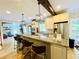 Bright kitchen features granite counters, stainless steel appliances, and stylish pendant lighting at 2870 Willow Wisp Way, Cumming, GA 30040