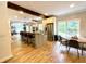 Modern kitchen featuring a central island, stainless steel appliances, breakfast bar seating, and stylish pendant lighting at 2870 Willow Wisp Way, Cumming, GA 30040