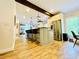 Modern kitchen with an eat-in island, stainless steel appliances, and hardwood floors at 2870 Willow Wisp Way, Cumming, GA 30040