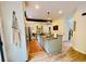 Spacious kitchen features a breakfast bar with seating, wood flooring, and stainless appliances at 2870 Willow Wisp Way, Cumming, GA 30040