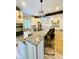 Spacious kitchen features a large island with granite countertops and modern light fixtures at 2870 Willow Wisp Way, Cumming, GA 30040
