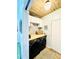 Convenient laundry room with modern washer and dryer, wooden ceiling, and ample storage space at 2870 Willow Wisp Way, Cumming, GA 30040