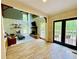 Spacious living room with a stone fireplace, clerestory windows, and hardwood floors at 2870 Willow Wisp Way, Cumming, GA 30040