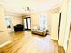 Inviting living room with hardwood floors, lots of natural light, and a comfortable sofa at 2870 Willow Wisp Way, Cumming, GA 30040