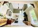 Stunning living room with high ceilings, fireplace, and ample natural light from large windows at 2870 Willow Wisp Way, Cumming, GA 30040