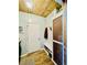 Functional mud room with built-in storage, coat hooks, and a wooden ceiling for added charm at 2870 Willow Wisp Way, Cumming, GA 30040