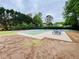 Community playground features sports court, picnic tables, and play area with mature trees at 2870 Willow Wisp Way, Cumming, GA 30040