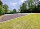 Community playground featuring a swing set, sport court, with lush green grass at 2870 Willow Wisp Way, Cumming, GA 30040
