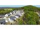 An aerial view showcases modern farmhouse homes nestled by lush green trees at 2977 Treeside Ter, Marietta, GA 30066