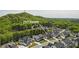 An aerial view showcases modern farmhouse homes nestled by lush green trees at 2977 Treeside Ter, Marietta, GA 30066
