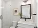 Modern bathroom features decorative wall tile and a glass shower at 2977 Treeside Ter, Marietta, GA 30066
