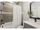 Well-lit bathroom featuring a tiled shower with modern fixtures at 2977 Treeside Ter, Marietta, GA 30066