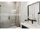 Contemporary bathroom features frameless glass shower and modern vanity at 2977 Treeside Ter, Marietta, GA 30066