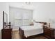 Comfortable bedroom features wood floors and warm lighting at 2977 Treeside Ter, Marietta, GA 30066