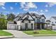 Beautiful two-story home with a side-entry garage, manicured lawn, and covered front porch at 2977 Treeside Ter, Marietta, GA 30066