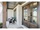 Welcoming front porch featuring stylish seating, brick flooring, and a grand double door entrance at 2977 Treeside Ter, Marietta, GA 30066