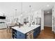 Open layout of the kitchen with a large island, dining space, and stainless steel appliances at 2977 Treeside Ter, Marietta, GA 30066