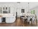 Open-concept kitchen with a large island, dining area, wine fridge and lots of storage at 2977 Treeside Ter, Marietta, GA 30066