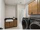 Convenient laundry room includes utility sink and modern appliances at 2977 Treeside Ter, Marietta, GA 30066