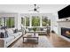 Bright and airy living room with a stone fireplace, large windows, and modern decor at 2977 Treeside Ter, Marietta, GA 30066