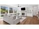 Cozy living room featuring a stone fireplace, large windows, and comfortable couches at 2977 Treeside Ter, Marietta, GA 30066