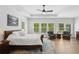 Bright main bedroom with plenty of natural light and a decorative rug at 2977 Treeside Ter, Marietta, GA 30066
