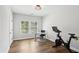 Bright office space with a stationary bike and a view of the trees at 2977 Treeside Ter, Marietta, GA 30066